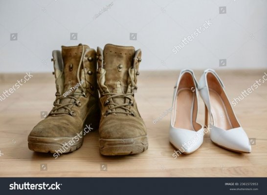 stock-photo-old-worn-military-boots-women-s-white-shoes-on-wooden-floor-veteran-and-family-con...jpg